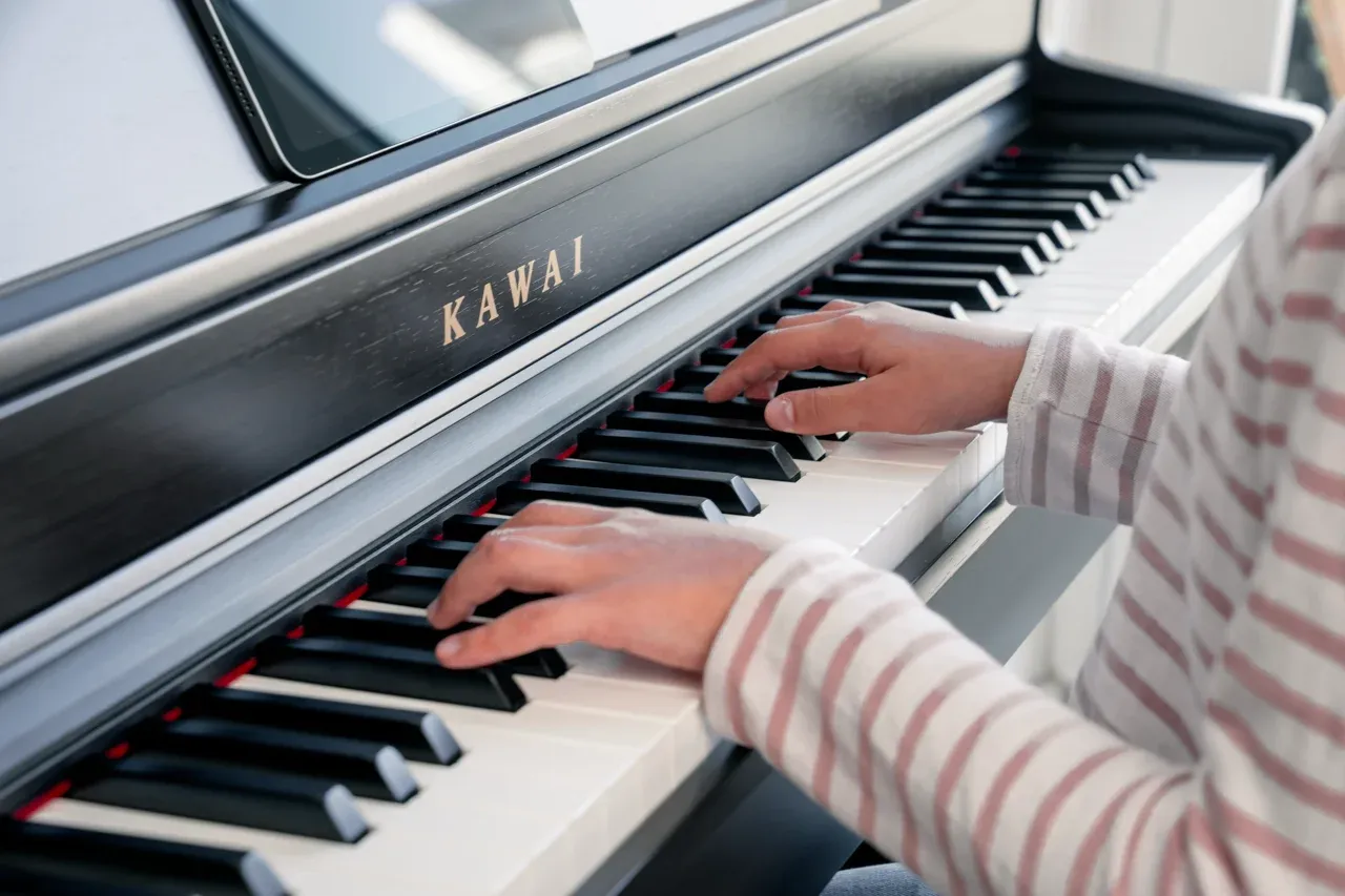Hands playing the Kawai CN301