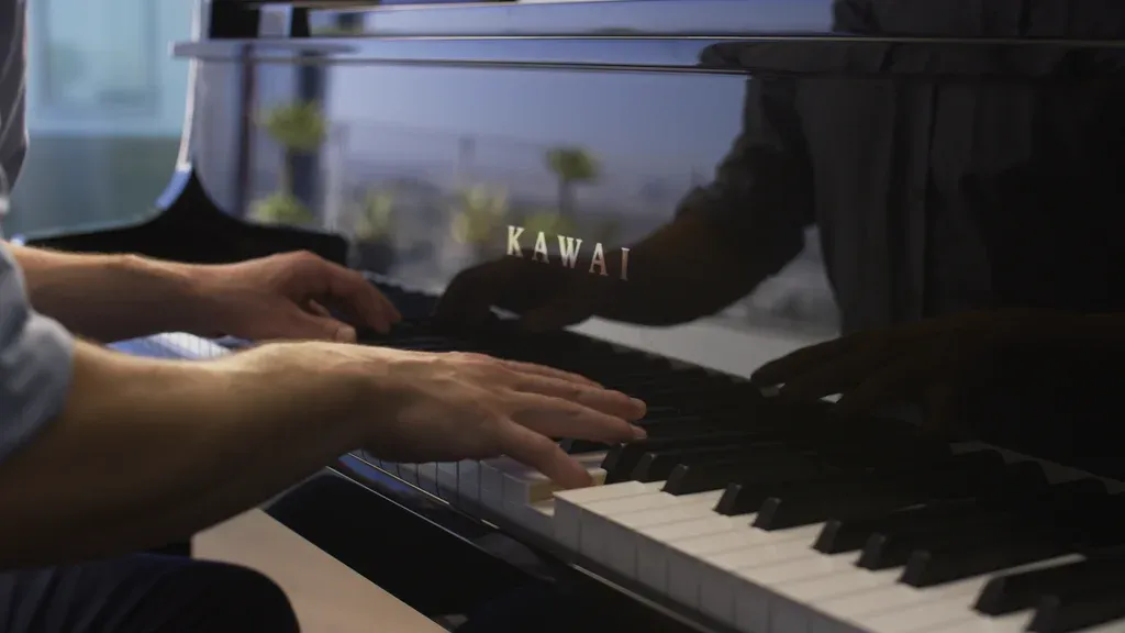 Hands playing the Kawai NV12 hybrid piano