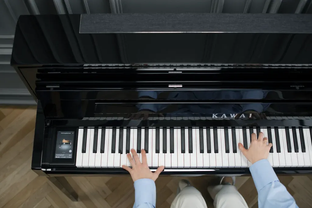 Pianist playing the Kawai NV6 hybrid upright piano