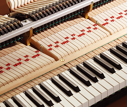 Extended spruce keys inside a Shigeru Kawai grand piano