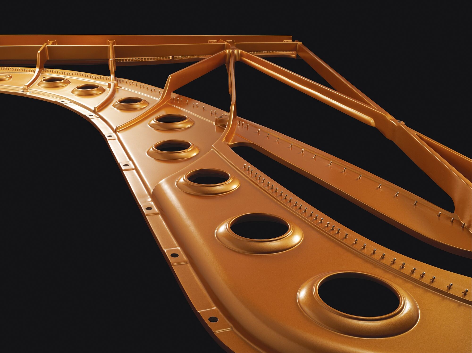 Bronze-colored metal frame inside a Yamaha grand piano
