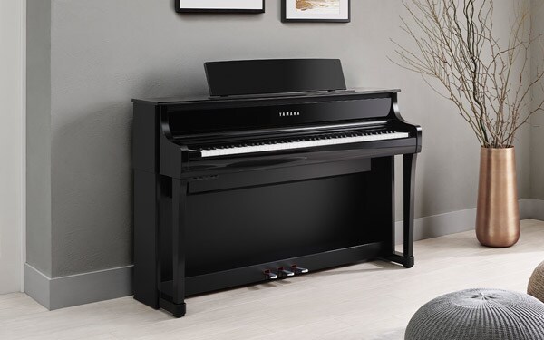 Yamaha Clavinova CLP-875 digital piano in a modern interior.