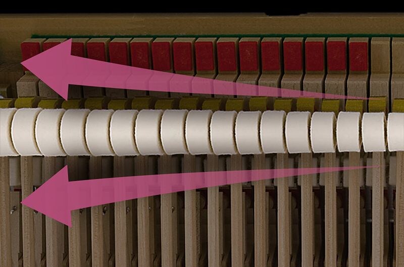Close-up of a piano hammer mechanism.