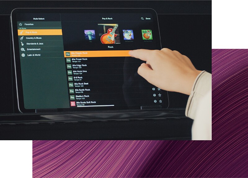 The Yamaha Smart Pianist app displayed on a tablet beside a Clavinova piano.