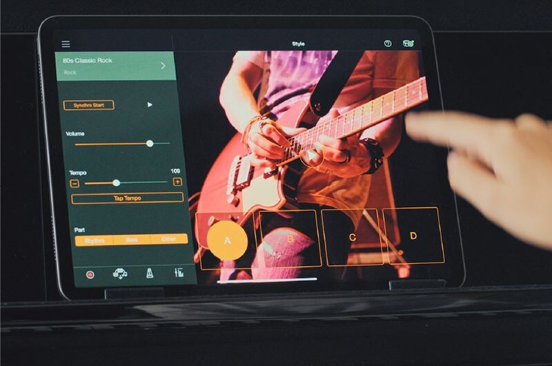 The Smart Pianist app showing backing styles on a tablet.