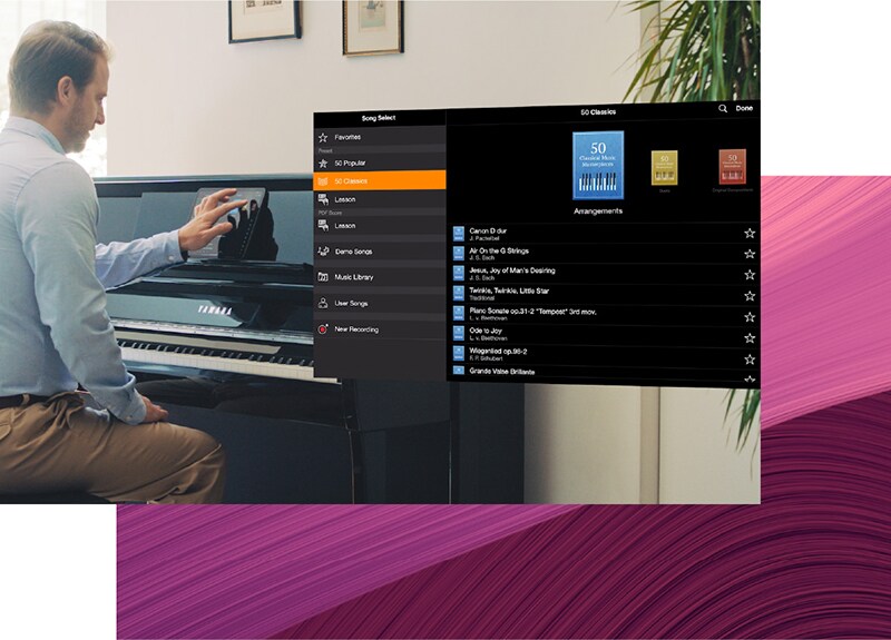 The Yamaha Smart Pianist song library displayed beside a Clavinova piano.