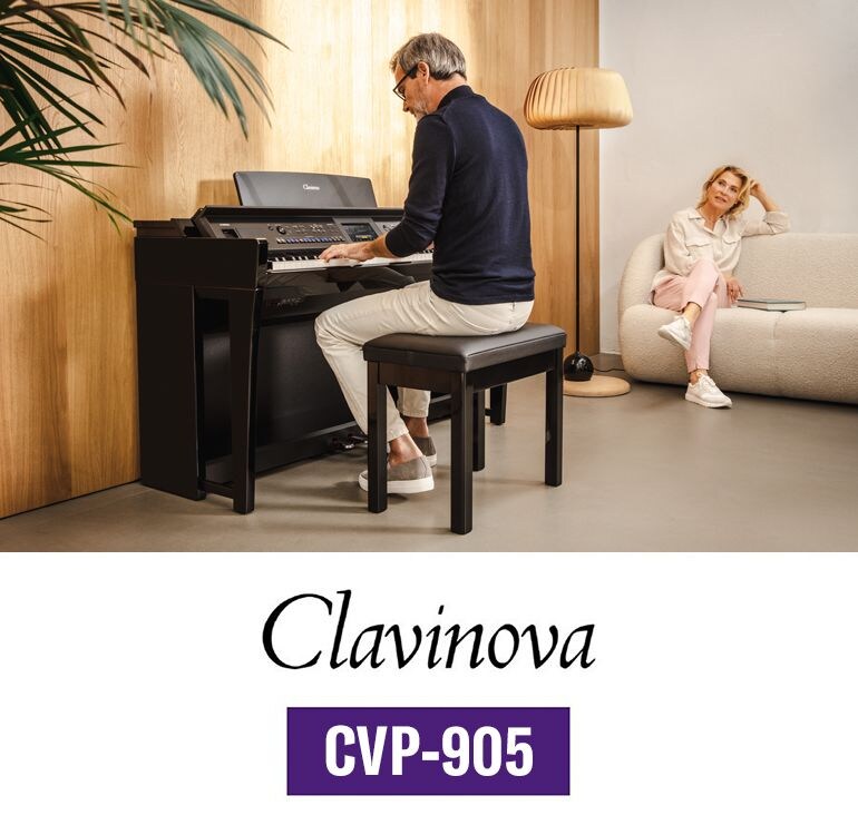 A Yamaha CVP-905 Clavinova being played in a bright living room