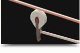 Piano hammer striking a string inside a Yamaha grand piano