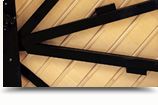 Wooden back posts and structural bracing inside a Yamaha grand piano