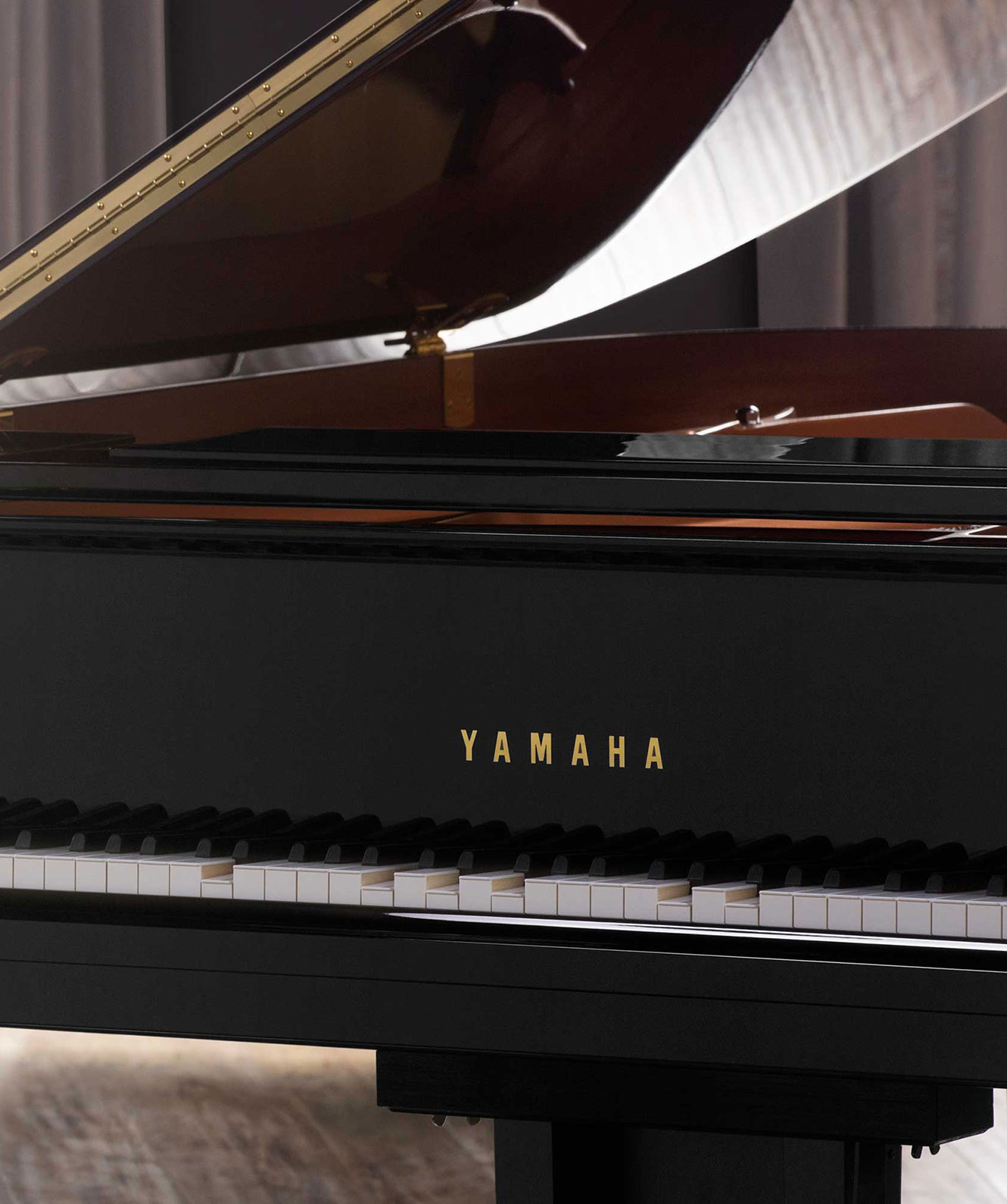 Yamaha Disklavier piano in a room with its lid open.