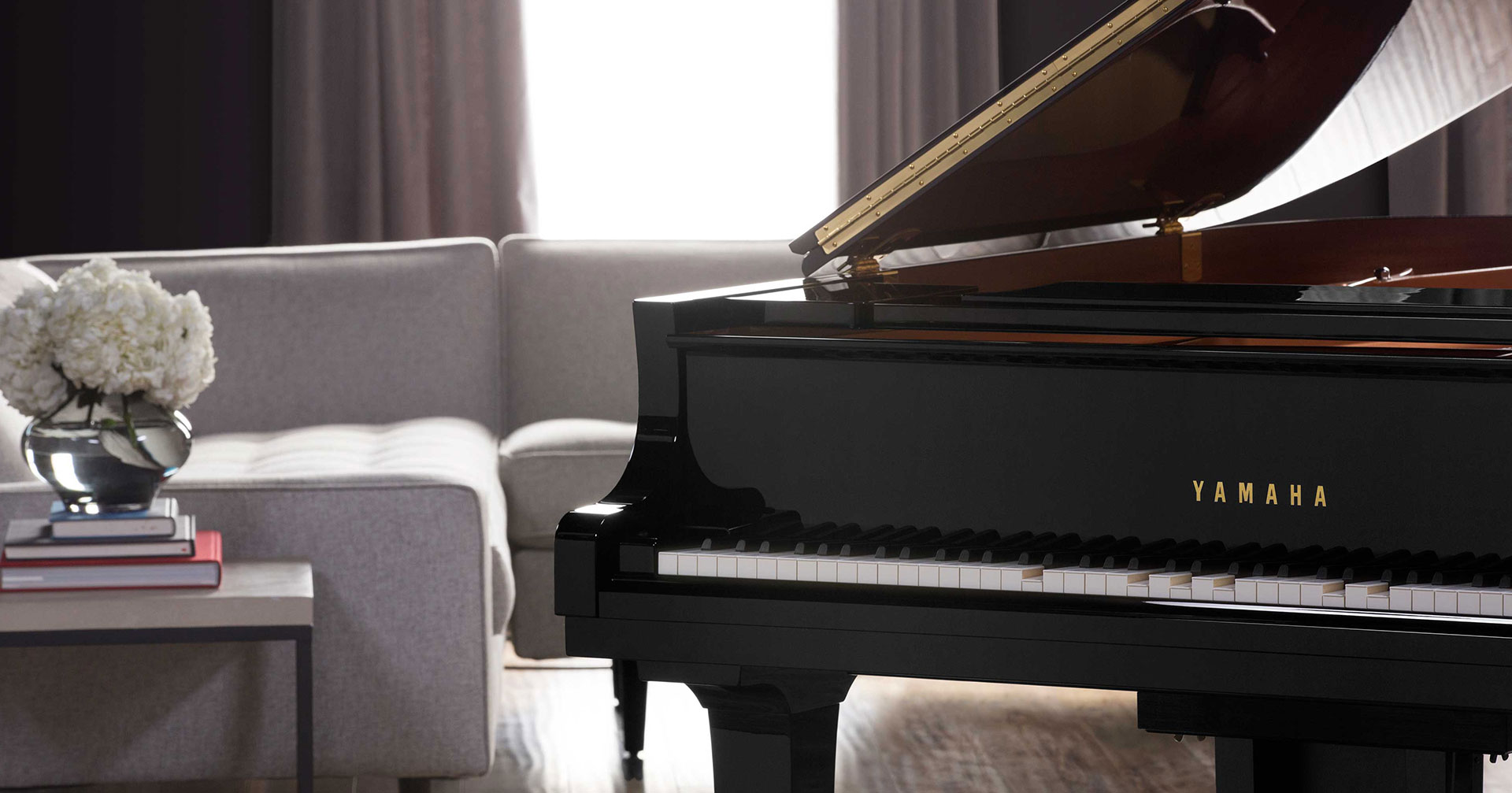 Lifestyle picture of Yamaha Disklavier piano in a bright, modern living room.