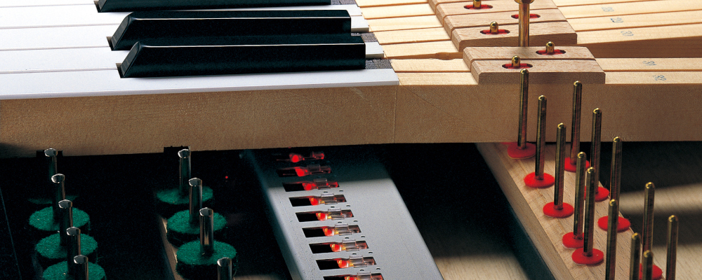 Inside view of Yamaha Disklavier piano mechanism.