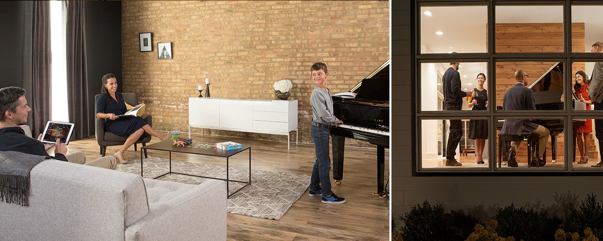 Family enjoying a Yamaha Disklavier ENSPIRE CL piano at home and guests gathering around a piano