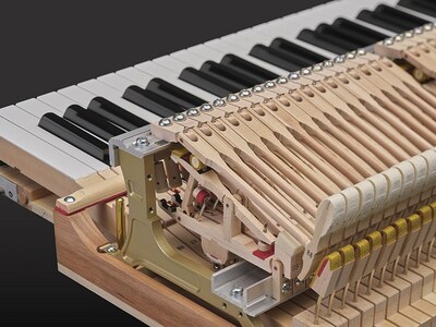 Ultra-precise action mechanism inside a Yamaha grand piano.