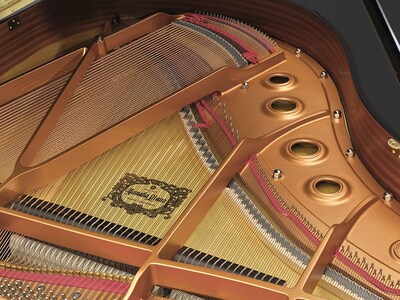 Cast iron frame and strings inside a Yamaha grand piano.