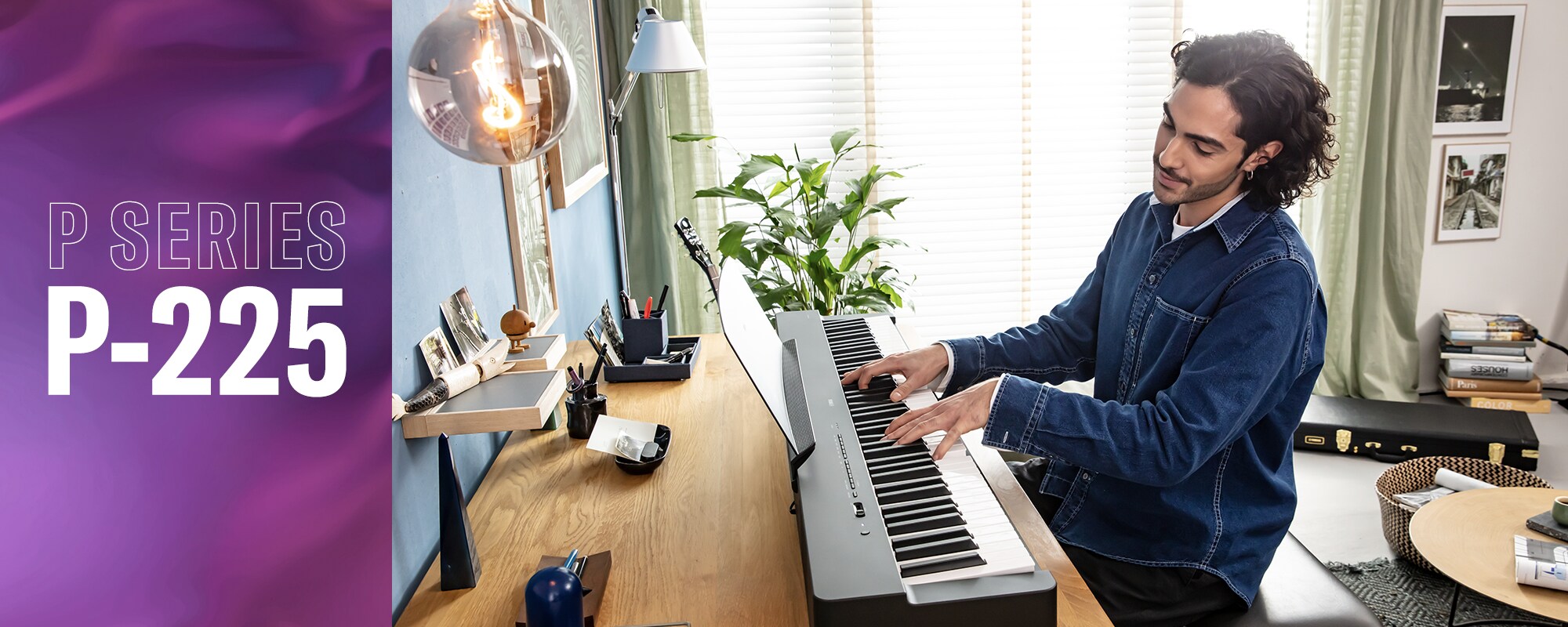 A person playing a Yamaha P-225 digital piano in a home setting.