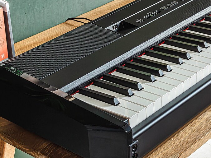 Close-up of the Yamaha P-525 keyboard and control panel